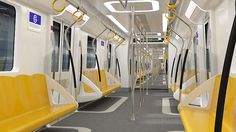 the interior of a subway train with yellow and white seats on each side, along with gray carpeting