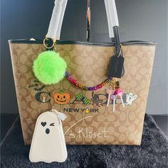 Only 1 Halloween Tote Bag Available Hard To Find Item. Rare Find Coach Tote 2022 Special Spooky Halloween Collection. Trick Or Treat! I Have Added A Rainbow Skull Bag Charm, Candy Charms And Pompom Charm For A Unique Look. Super Cute For Any Spooky Lover All Year Round! Details; Signature Coated Canvas And Smooth Leather Inside Zip Pocket Snap Closure Handles With 10" Drop 13" (L) X 11 1/2" (H) X 6 1/4" (W) This Set Includes The Coach Ghost Leather Coin Purse. Beautiful Set, Photos Were Taken Ou Coach Bags Handbags 2022, Candy Charms, Rainbow Skull, Skull Bags, Halloween Tote Bag, Halloween Tote, Halloween 2022, Coach Tote, Leather Coin Purse