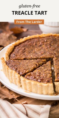 a close up of a pie on a plate with the text gluten - free treacle tart from the ladder