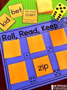 a roll, read, keep board game with dices and sticky notes on it