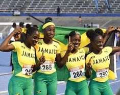 the jamaica olympic team poses for a photo before competing in the women's 4x10m relay