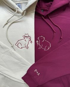 two different colored hoodies on top of each other