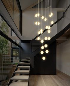 a modern chandelier hanging from the ceiling