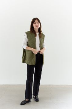 "Quilted liner Vest in Olive Green. Diamond Quilting pattern. Open front, no closure. Maker: British Military |  Material: Cotton Condition: Great! with a few faded white marks.  LARGE: Shoulders: 17\"  |  Chest: 23.5\"  |  Length: 28\"  Cassie is 5'8\" and wears a modern small. This could fit a larger frame. SHOP http://www.rawsonstudio.etsy.com FOLLOW US + instagram | @_rawson + pinterest | rawson *No Returns. Items are eligible for store credit only. We ask that the buyer ship to provided address and a credit code is issued for one year.*" Unisex Winter Outfits, Quilted Sleeveless Jacket, Olive Green Quilted Jacket Outfit, Green Vest Outerwear For Layering, Green Layering Vest Outerwear, Everyday Cotton Vest Outerwear, Versatile Cotton Vest For Layering, Sleeveless Green Outerwear For Layering, Spring Everyday Vest Outerwear