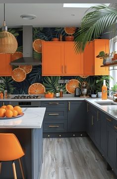 an orange themed kitchen with palm leaves on the wall and wooden flooring is featured in this image