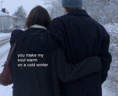 two people walking in the snow with their arms around each other, one person has his back to the camera