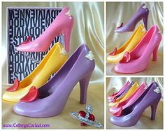 four pictures of colorful high heel shoes with bows on the toes and one has a diamond brooch