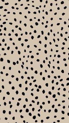 an animal print pattern with black spots