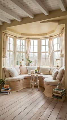 a living room filled with furniture and windows