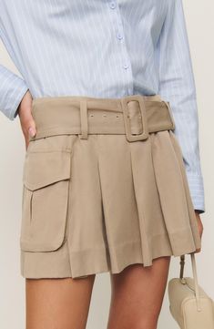 Utility and preppy aesthetics are having a moment right now and Reformation offers a hybrid option in this pleated khaki miniskirt with spacious cargo pockets. Removable belt Cargo flap-patch pockets 100% Tencel® lyocell Tencel lyocell is a more-sustainably produced fiber made with closed-loop processing Machine wash, tumble dry Imported Pleated Cargo Skirt, High Rise Skirt, Khaki Skirt, Cargo Skirt, Khaki Color, New Tops, A Line Skirts, New Dress, Mini Skirt