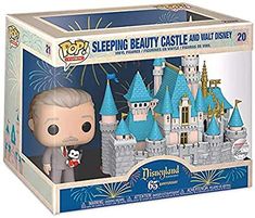 a pop vinyl figure in a box with a castle on the front and fireworks behind it