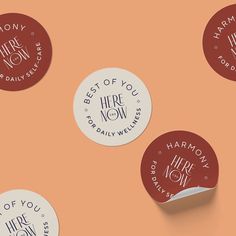 four round stickers with the words best of you, hire now and here now on them