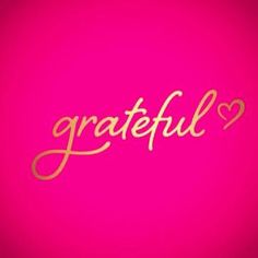 the word grateful written in gold on a pink background