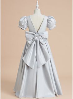 a dress with a bow on the back