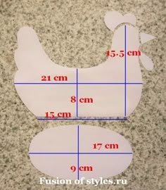 the measurements of a chicken cut out from paper