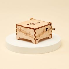 a wooden music box with musical notes on it