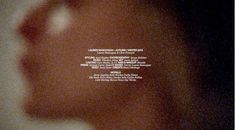 a blurry photo of a person's face and the words underneath it are in white