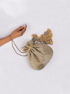 Deep Grey Chandani Potli Bag By Vareli Bafna now available at Trendroots Festive Gold Bag With Tassels, Festive Celebration Bags With Tassels, Elegant Festive Tassel Bags, Elegant Festive Bags With Tassels, Festival Potli Bag With Tassels For Party, Festive Party Bags With Tassels, Gold Potli Bag With Tassels For Festivals, Festive Elegant Potli Bag With Tassels, Traditional Gold Potli Bag With Tassels