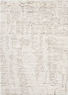 an area rug with white and beige colors