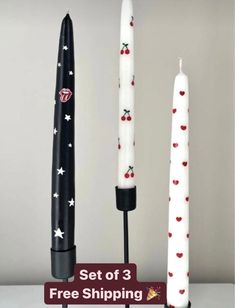 three candles sitting next to each other with the words set of 3 free shipping on them