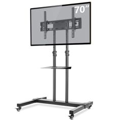 a tv stand with a large flat screen on it's top and bottom shelf