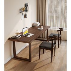 a wooden desk with two chairs and a laptop on it in front of a window