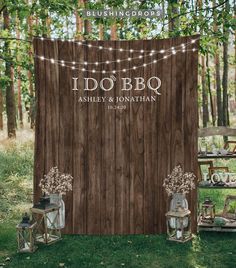 an outdoor wedding with wooden backdrop and string lights