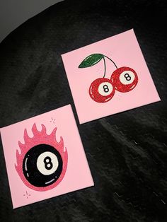 two pink cards with black and white billiards on them