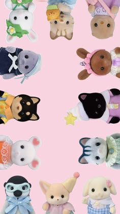 many small stuffed animals on a pink background