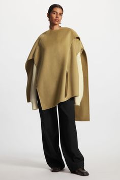 WOOL-BLEND CAPE - Light brown - Outdoor layers - COS Oversized Chic Wool Poncho, Chic Oversized Cape Poncho, Chic Oversized Poncho Cape, Chic Oversized Cashmere Cape, Oversized Cashmere Cape With Long Sleeves, Chic Wool Cape With Cape Sleeves, Chic Shawl Cape For Fall, Chic Oversized Cape With Batwing Sleeve, Chic Oversized Cape For Workwear