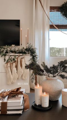 a living room with candles and christmas decorations