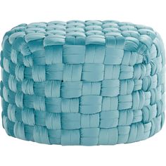 a large blue woven basket sitting on top of a white floor