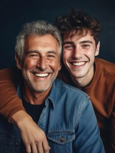 two men are smiling and posing for the camera