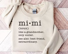 Just the thing for the cool Mimi! ▸ Gildan 18000 Sweatshirt ▸ 55% cotton/45% polyester ▸ Unisex Adult Sizing  ▸ Props used In photos are NOT included with purchase  WASHING INSTRUCTIONS ▸ Wash inside out, in cold water, on gentle cycle. Tumble dry low or let air dry  ▸ Do not use Fabric Softeners or Bleach ▸ Do not dry clean. Avoid ironing on the design.  SIZE ▸ Take a look at the photos to see a specific sizing chart for this sweatshirt style ▸ Please note that these shirts are unisex size meaning they are not women's fitted shirts.  ▸ Lay your favorite shirt at home flat and measure armpit to armpit to compare to the size chart in the photos RETURNS OR EXCHANGES ▸ All of our shirts are custom printed just for you so we do not accept returns or exchanges due to size ▸ If there are any iss Mimi T Shirt Ideas, Mimi Shirt Ideas, Mimi Shirts, Mimi Grandma, Wrestling Mom Shirts, Cricket Projects, Wrestling Mom, Fitted Shirts, Sweatshirt Style