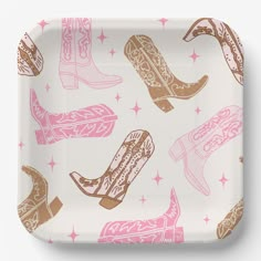 a white tray with pink and gold cowboy boots on it, all over the surface