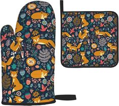 two oven mitts with foxes and flowers on them, one has an oven mitt in