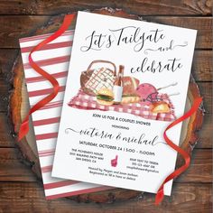 an image of a picnic and celebrate party card on a wooden table with red ribbon