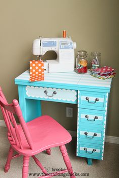 a pink chair sitting next to a desk with a sewing machine on top of it