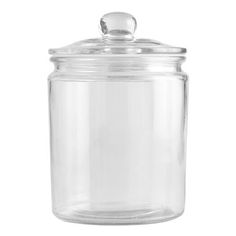 a clear glass jar with a lid on a white background, it is empty and ready to be used for storage