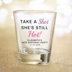 a shot glass that says take a shot she's still hot