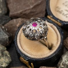 This lovely floral ring is crafted of 14k white gold and features a lab created ruby center with natural diamond accents. The ring is currently a size 4. Vintage Ruby Rings, Antique Engagement Rings Sapphire, Estate Jewelry Rings, Wedding Ring Diamond Band, Floral Ring, Ruby Engagement Ring, Antique Engagement Rings, European Cut Diamonds, Engagement Rings Sapphire