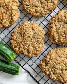 zucchini cookies on a cooling rack next to cucumbers