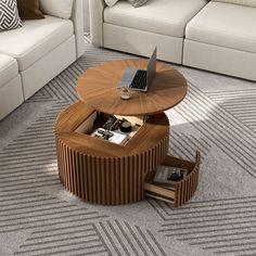 a coffee table with a laptop on it in the middle of a carpeted living room