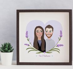 a couple's portrait is displayed in a frame next to a potted plant