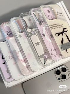 the case is clear and has pink stars on it, along with other cases for iphones