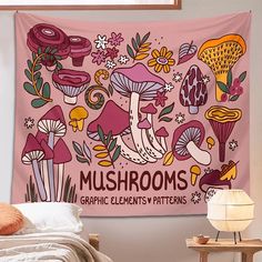 a pink wall hanging over a bed covered in mushrooms and plants with the words mushrooms graphic on it