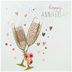 an anniversary card with two champagne flutes