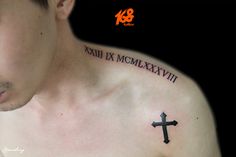 a man with a cross tattoo on his chest