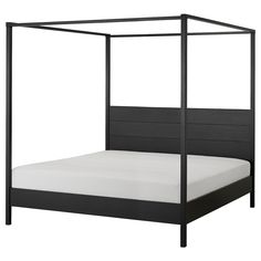 a black bed frame with white sheets and pillows on the bottom, in front of a white background