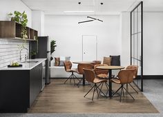 an office with chairs and tables in it